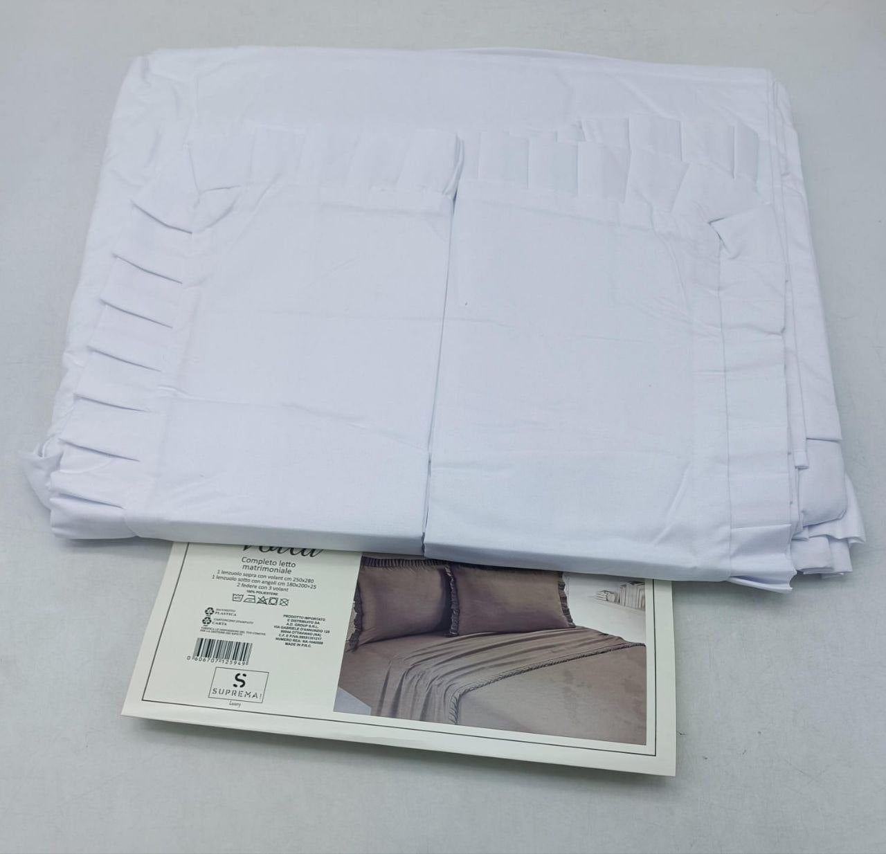 Lenzuola tinta unita con rouche